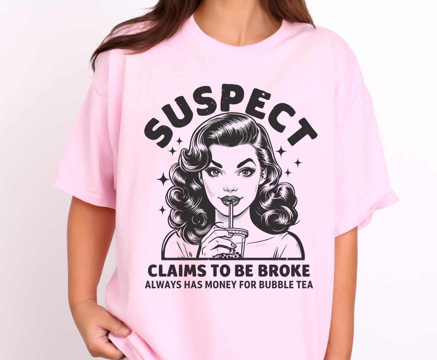 Bubble Tea T-shirt. Image of a woman drinking a bubble tea drink, with the text 'Suspect claims to be broke always has money for bubble tea