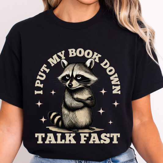 I put my Book Down Funny Raccoon T-Shirt