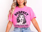 Smutty Books Pink T-shirt for Women. Image of a 50&#39;s housewife looking shocked with the text &#39;Suspect claims to be tired spends 2 hours reading smutty books&#39;